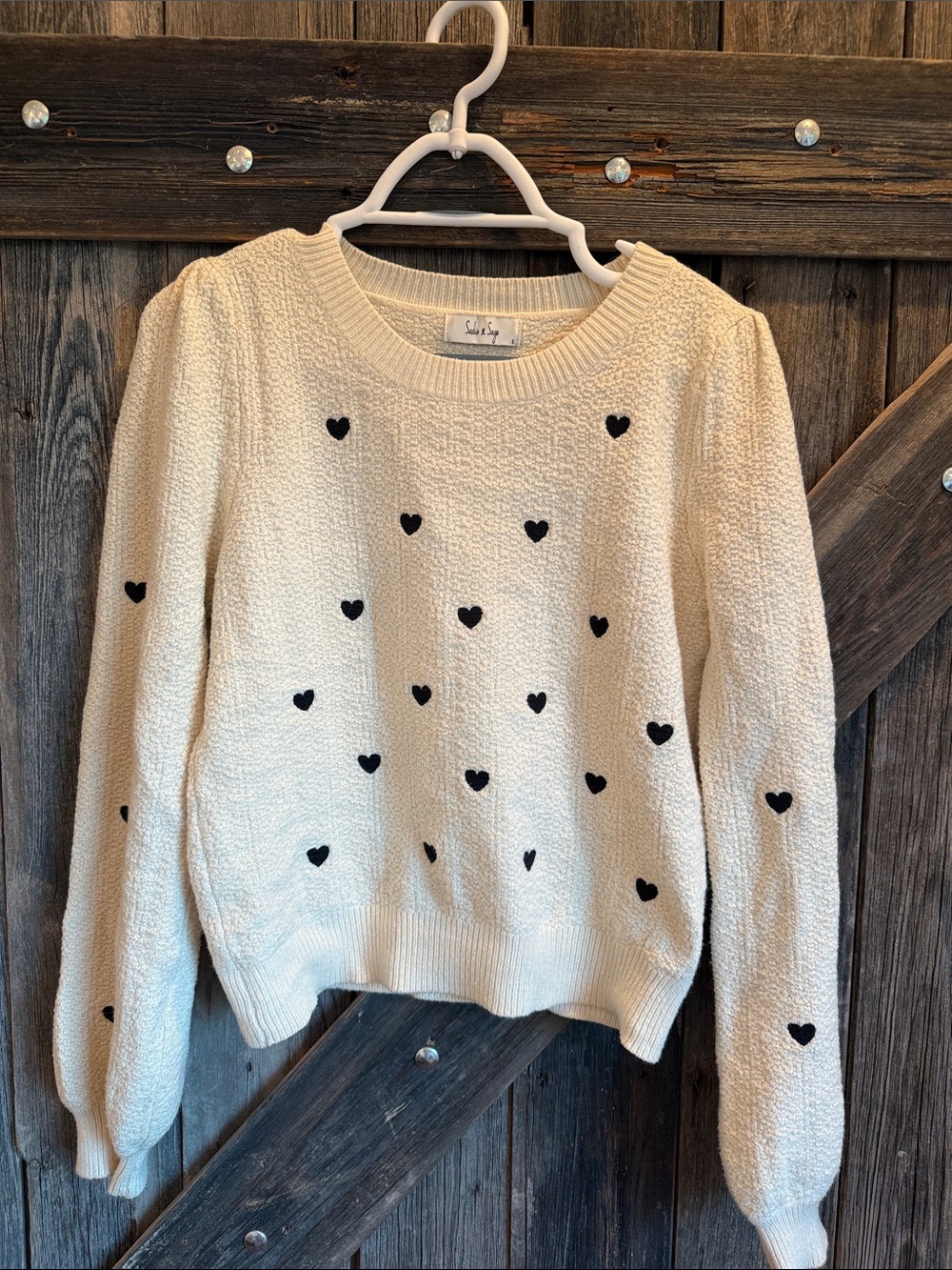 Sadie and Sage Cream Crewneck Sweater with Black Heart Motif